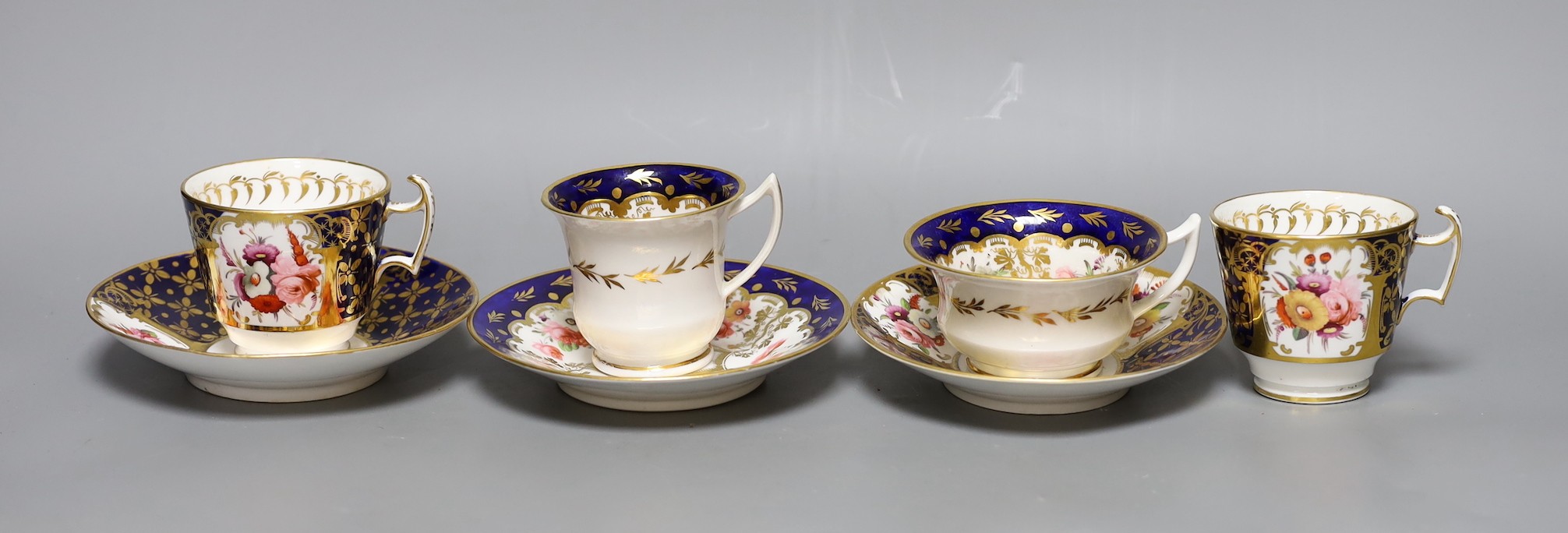 An early 19th century pair of Coalport coffee cups and saucer painted with pattern 793 and a New Hall Coffee cup, teacup and saucer, See M. Messanger, Coalport, page 168, plate 114 for pattern 793, New hall cup 6.5 cms h